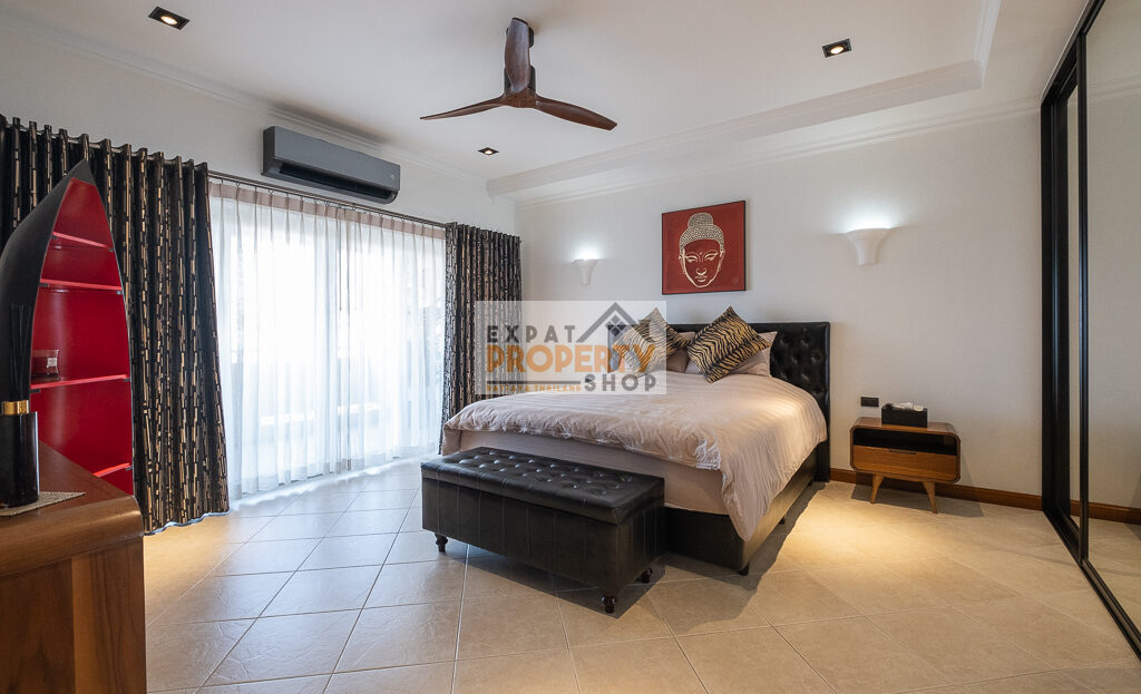 Fully furnished master bedroom with built-in wardrobes